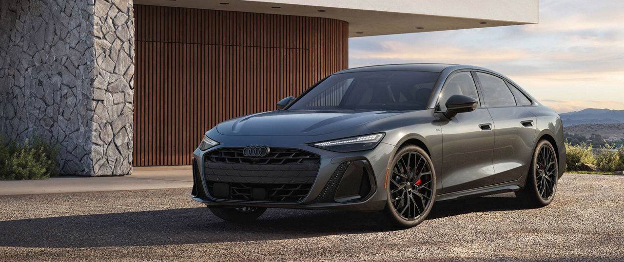 2026 Audi A6 parked beside a modern-style house