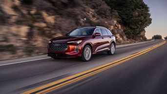 Three quarter view of an Audi Q5 accelerating.