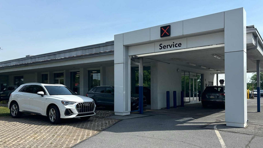 Side view of an Audi outside of the service department