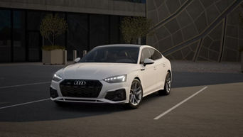 Three quarter profile view of an Audi A5, parked.