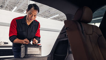 Service advisor servicing vehicle.