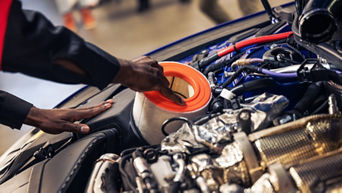 Oil filter being replaced