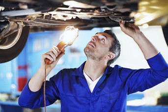 Service technician servicing air filter.