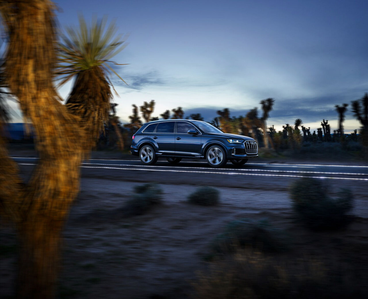 Audi Q7 side view on a rainy day