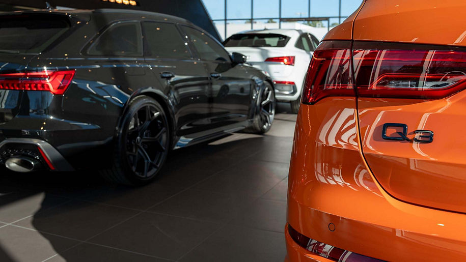 Rear profile view of an Audi Q3 parked.