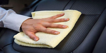 Car being wiped with cloth