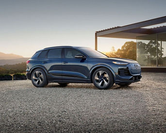 Side profile view of an Audi Q6. 