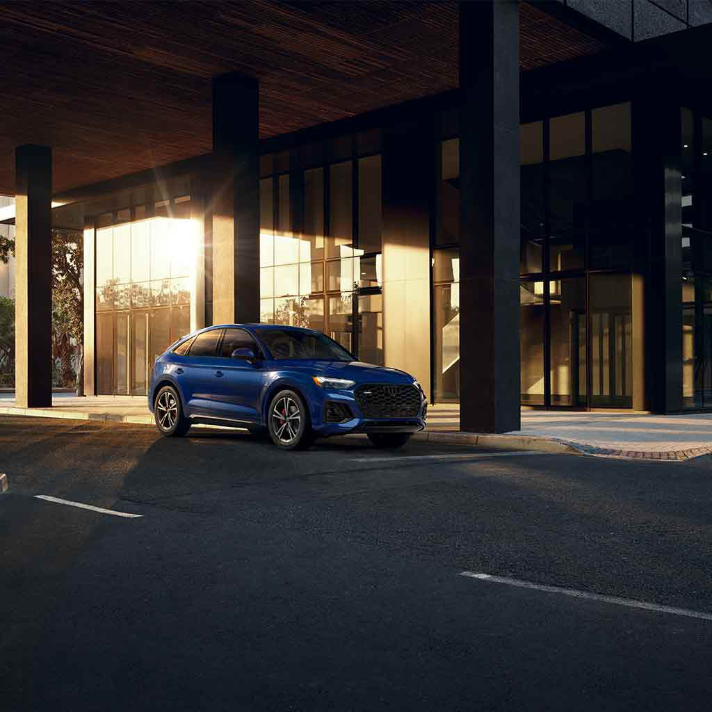 Side profile view of an Audi Q5 parked. 