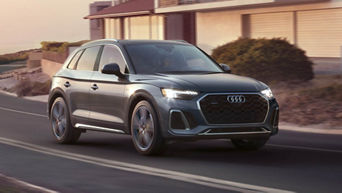 Side view of an Audi Q5 accelerating.