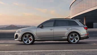 Side view of an Audi Q7 parked.
