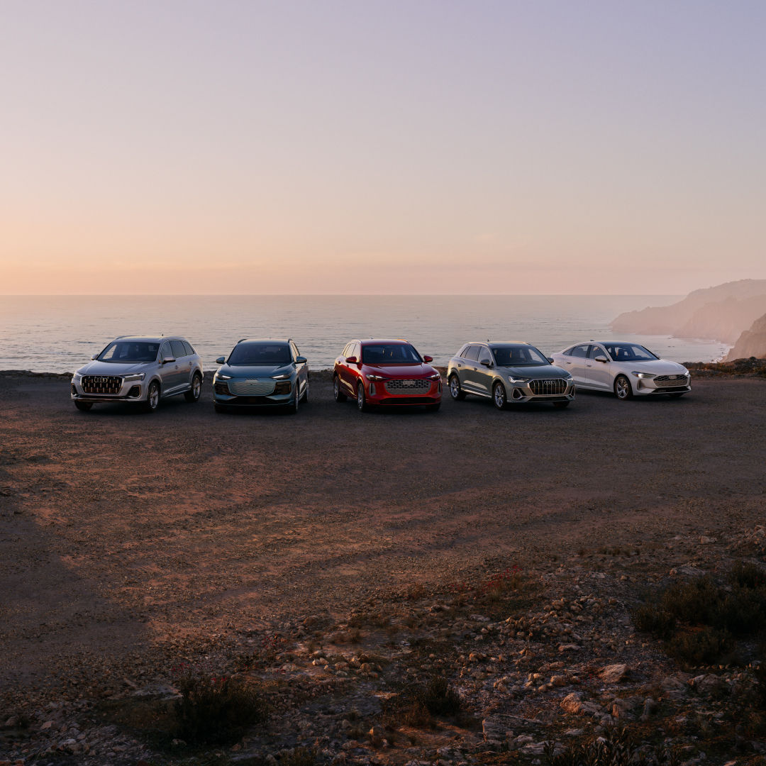 Front view of Audi models parked.