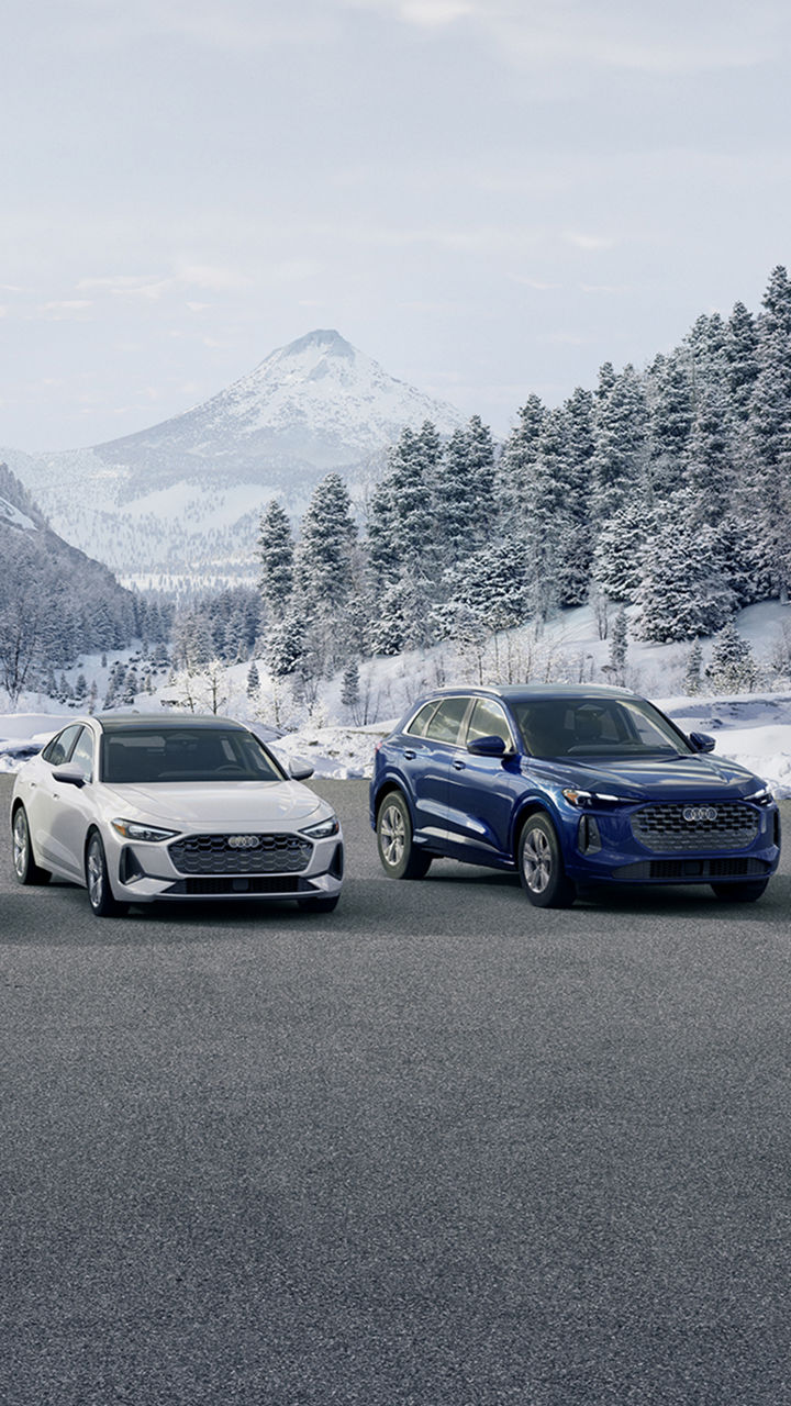 Front view of Audi models parked.