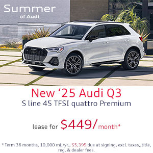 Side view of an Audi Q3 driving.
