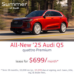 Side view of an Audi Q3 driving.