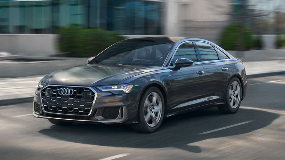Left profile view of an Audi A6 accelerating.