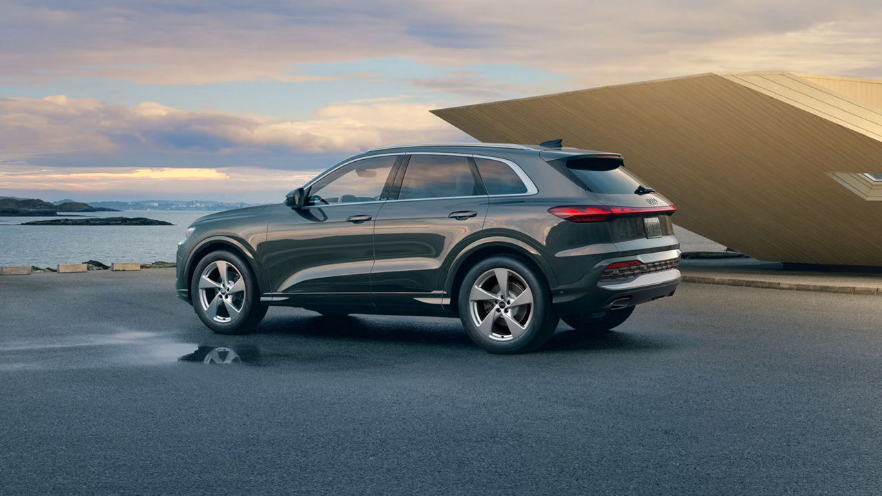 Image of a 2025 Audi Q5 parked in front of a lake