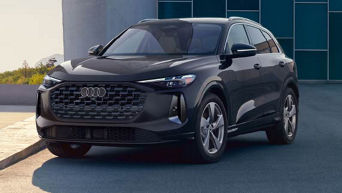 Three quarter profile view of an Audi All-new Q5 Premium TFSI® quattro® S tronic® parked.