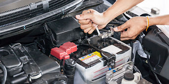 Technician replacing a battery.
