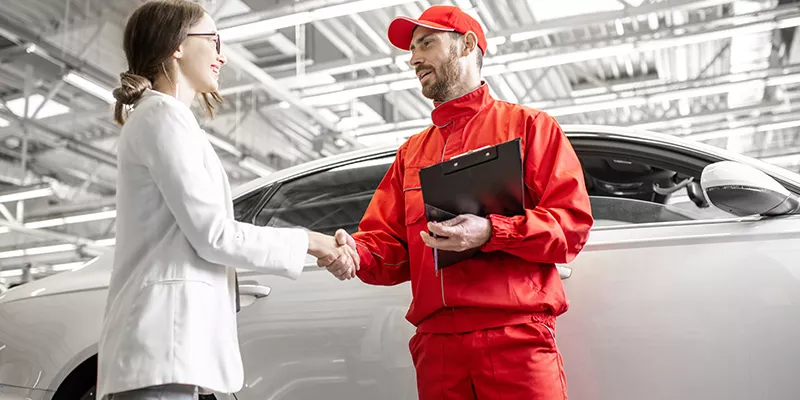 Technicians at the service of an auto dealership.
