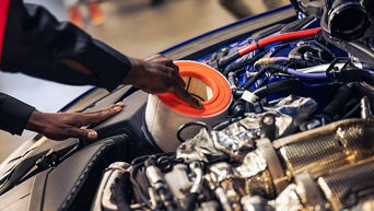 Audi genuine parts being installed in an engine. 