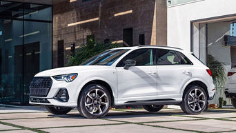 Front side view of a 2025 Audi Q3 parked.