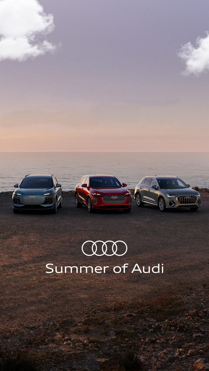 Three quarter profile view of an Audi Q5 accelerating.
