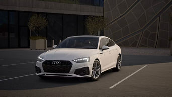 Three quarter profile view of an Audi A5 parked.