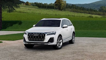 Three quarter profile view of an Audi Q7 parked.