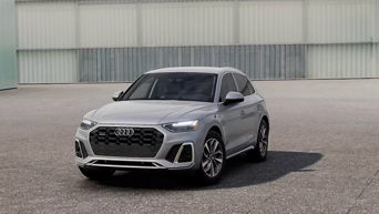 Three quarter profile view of an Audi Q5 parked.
