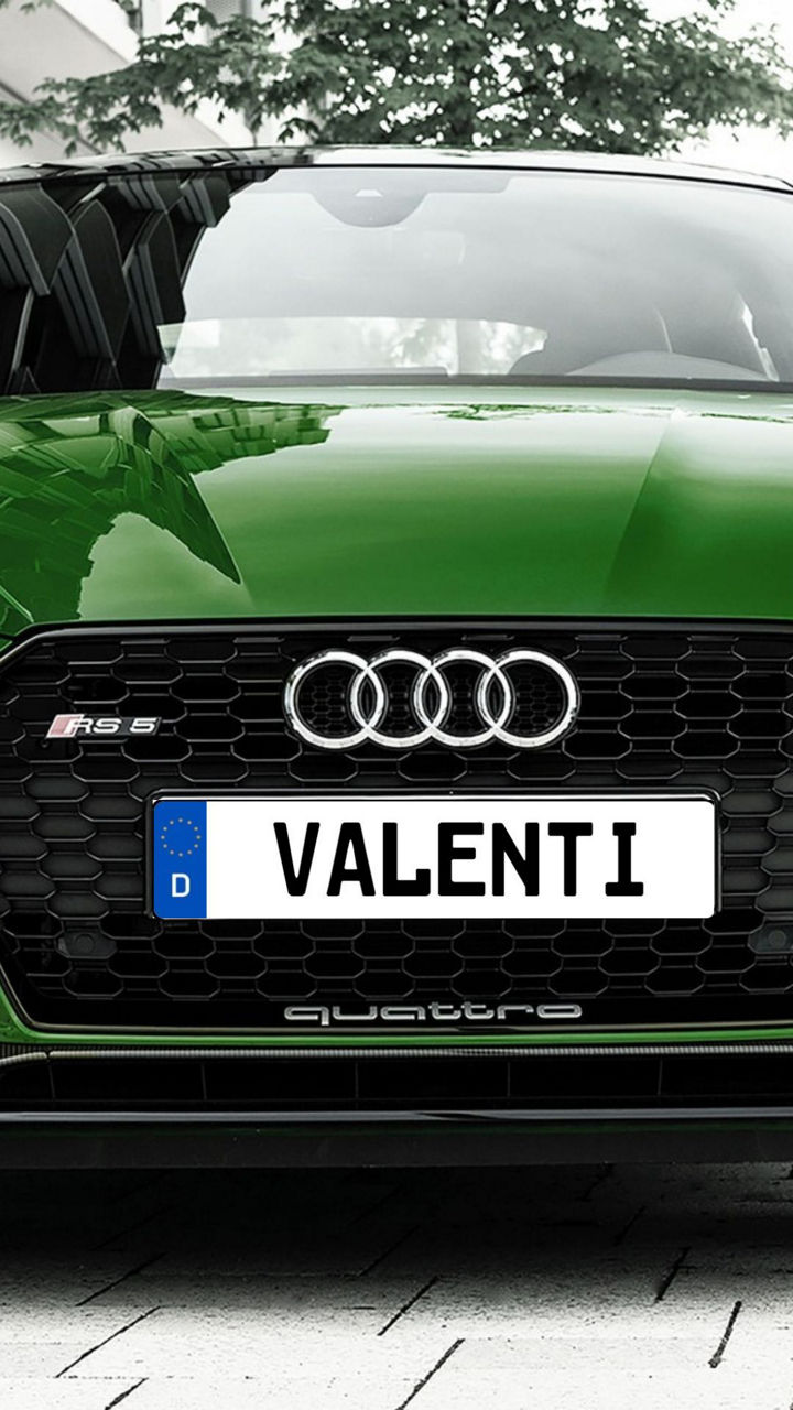 Parked green Audi with Valenti license plate.