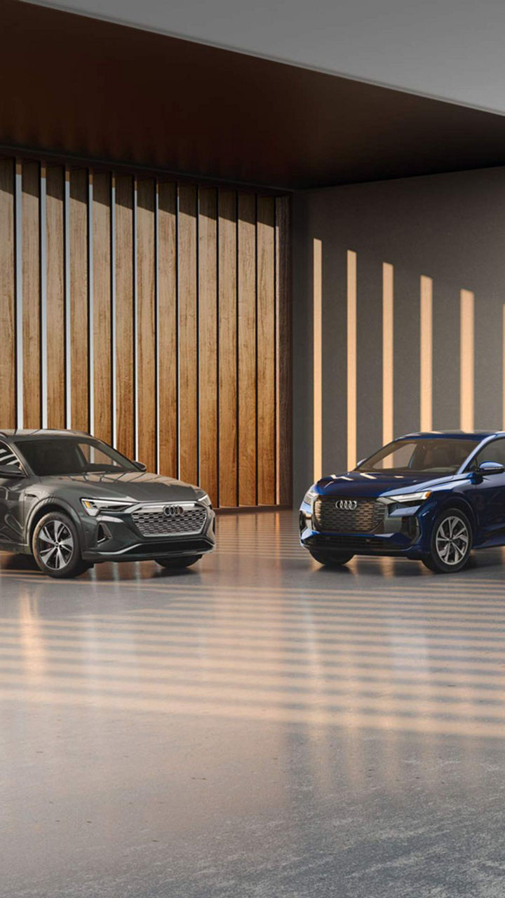 Front view of Audi electric vehicles parked.