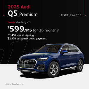 Side view of an Audi Q5 parked.