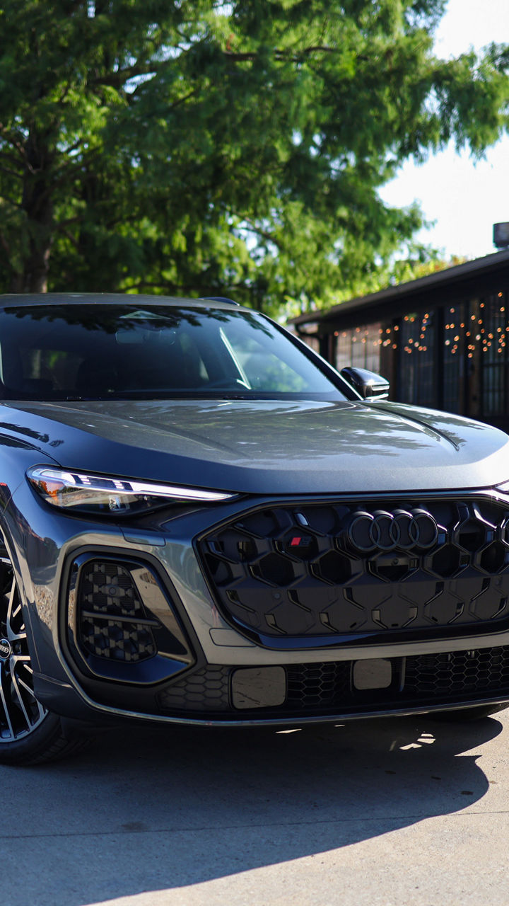 Audi 2025 Audi Q6 e-tron left profile driving.