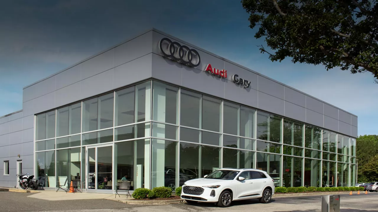 Audi employee polishing an Audi SUV