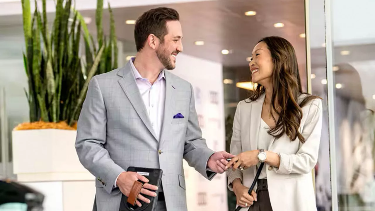 Audi sales representative shaking hands with a customer