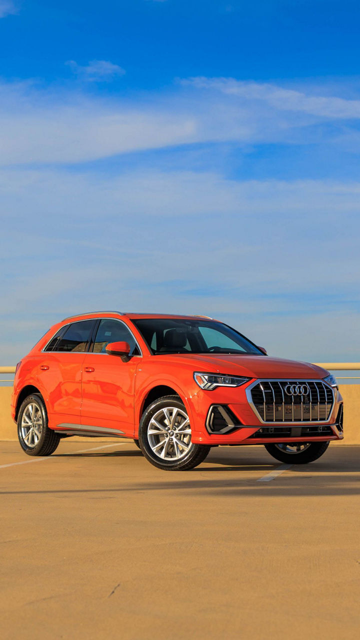 Side view of an Audi parked.