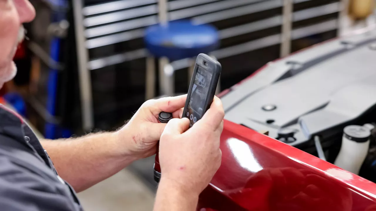 Interior view of an Audi steering wheel and dashboard.