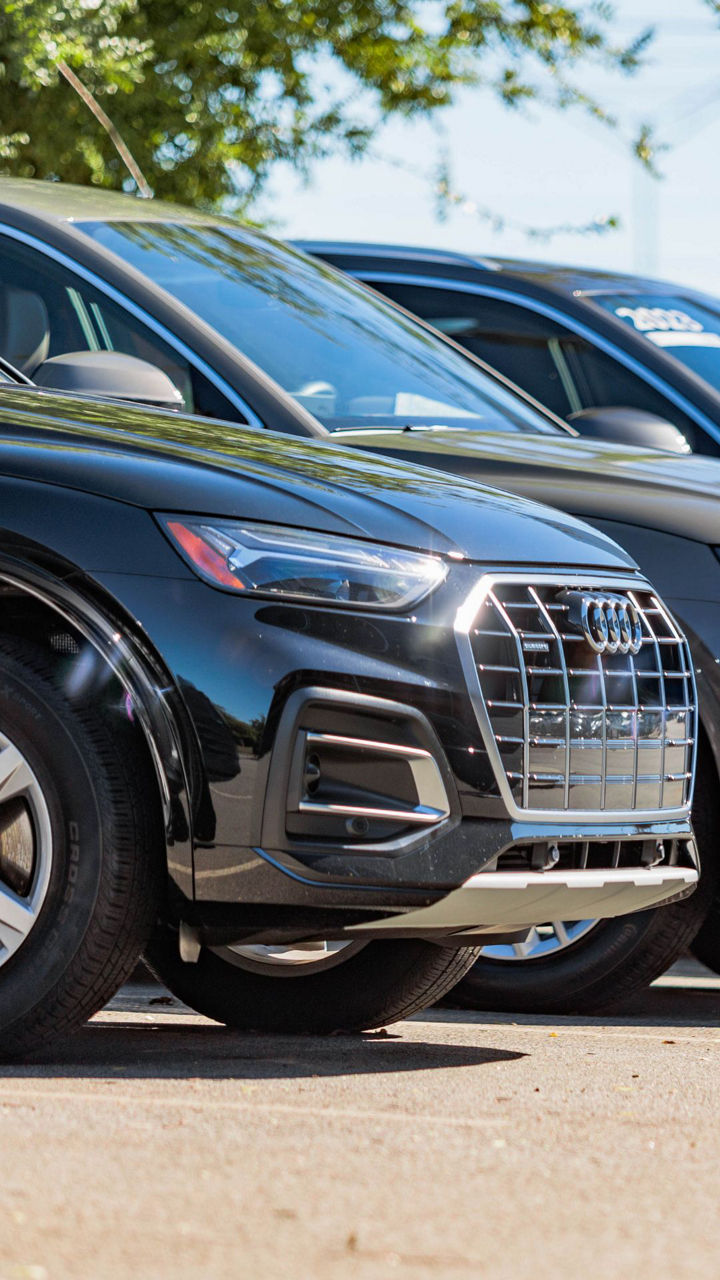 Three quarter view of an Audi parked.