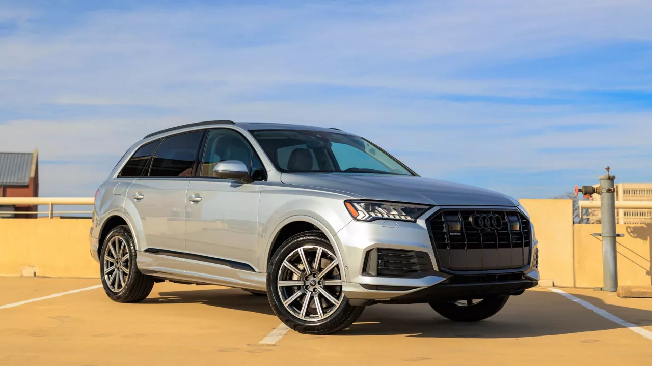 Three quarter view of an Audi vehicle parked.