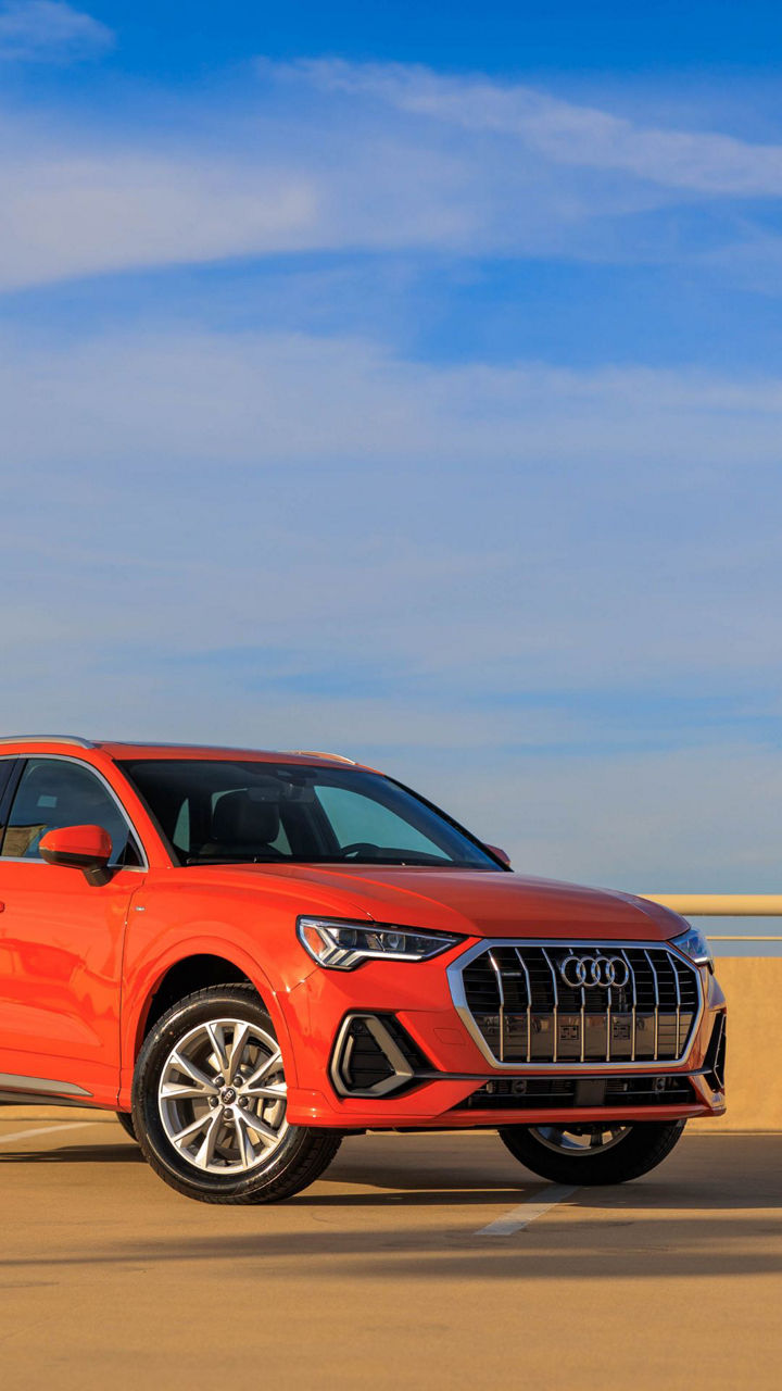 Right side profile of an Audi Q8 e-tron parked.