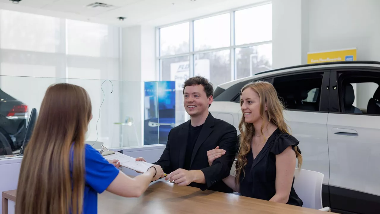 Audi sales technician working with a customer.
