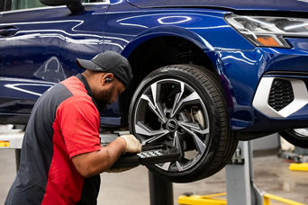 Audi Technician Armid Fixing Tire