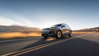 2025 Q6 e-tron driving on back road out West