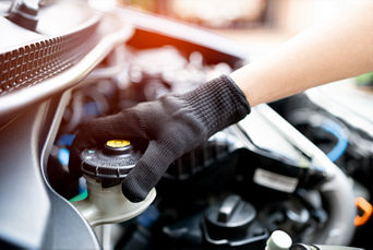 Technician Flushing brake fluid.