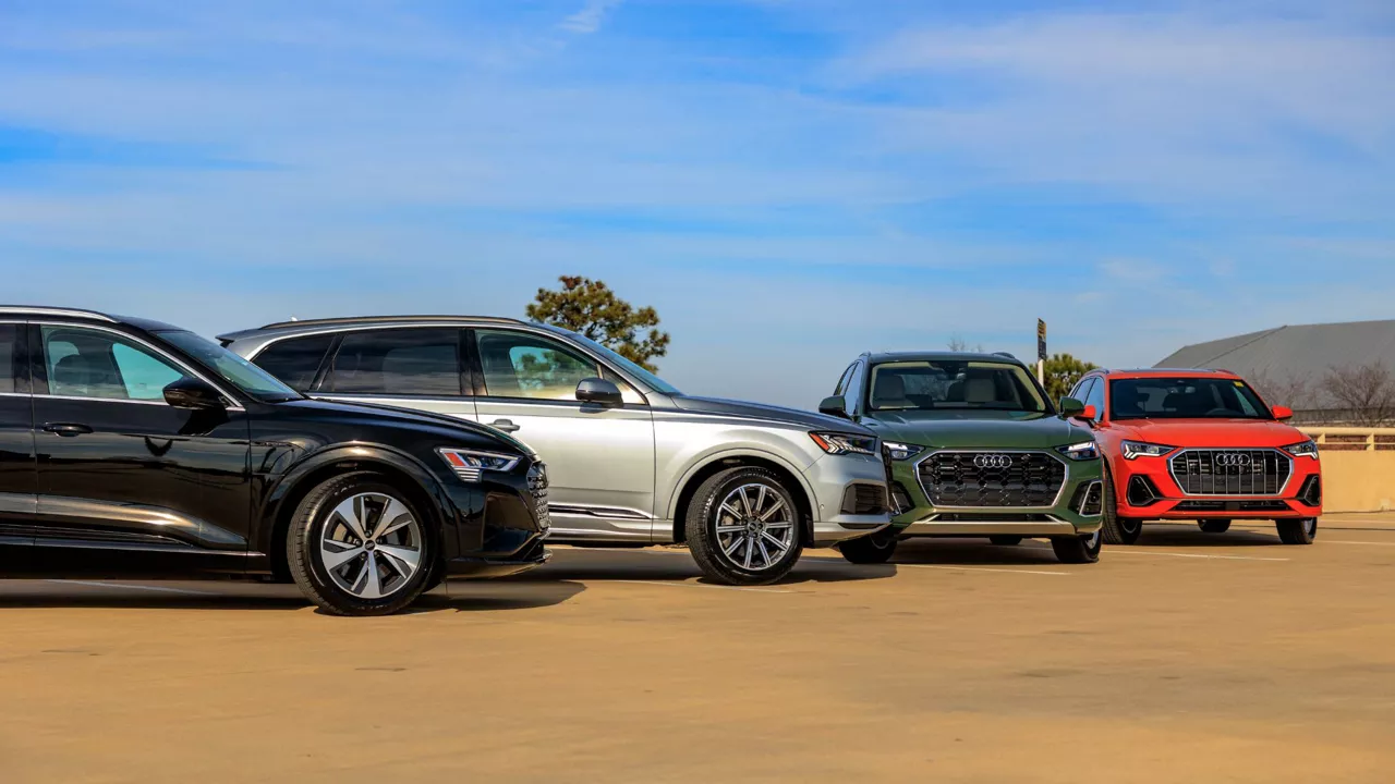 Four Audi vehicles parked.