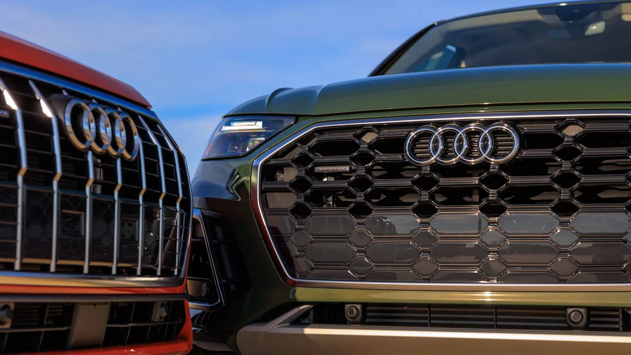Three quarter view of an Audi vehicle parked.