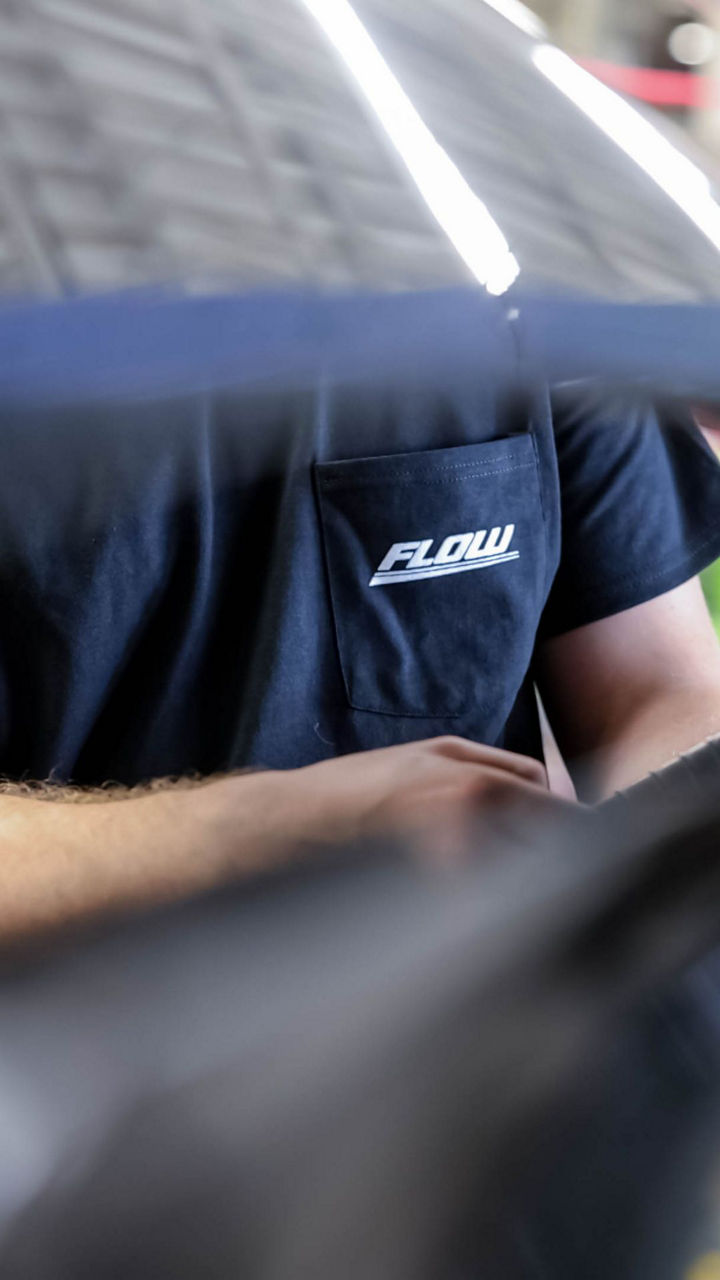 Audi service technician servicing a vehicle.