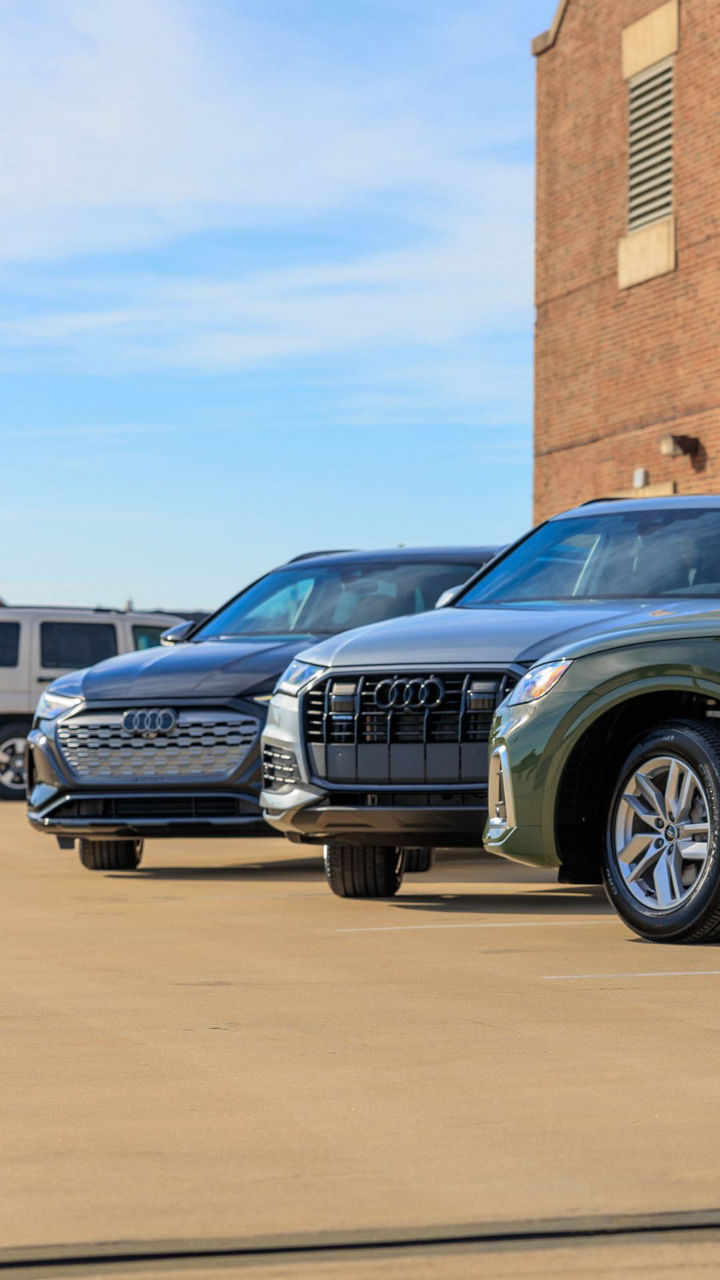 Three quarter view of an Audi parked.