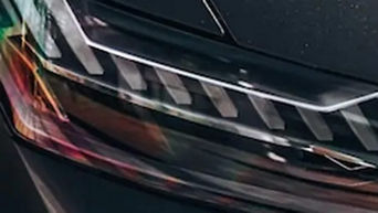 Close-up view of a headlight.