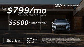 Front profile of an Audi Q7 parked.